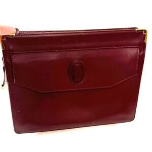 Cartier Burgundy Wristlet pouch with exterior front pocket w/interior peeling
